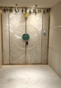 A finished selenite door with green jewel in the middle